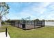Lakefront playground with swings, climbing ropes, and benches at 3237 Palatka St, Orlando, FL 32824