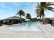 Community pool featuring palm trees and zero entry access, ideal for Gathering enjoyment and recreation at 3237 Palatka St, Orlando, FL 32824