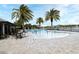 Community pool with palm trees and splashpad, perfect for Gathering fun and relaxation at 3237 Palatka St, Orlando, FL 32824