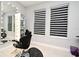 Salon area with black styling chair, illuminated mirror, and plenty of natural light at 3237 Palatka St, Orlando, FL 32824