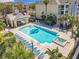 Overhead view of community pool, pool house, hot tub, and lounge area at 3403 Greenwich Village Blvd # 104, Orlando, FL 32835
