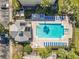 Aerial shot of a community pool featuring a pool house and spa at 3403 Greenwich Village Blvd # 104, Orlando, FL 32835