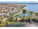Community view features residences near a lake with a pond and fountain for picturesque scenery at 3403 Greenwich Village Blvd # 104, Orlando, FL 32835