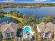 Beautiful aerial view of lakefront property and pool at 3403 Greenwich Village Blvd # 104, Orlando, FL 32835