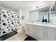 Bathroom with a double vanity, modern fixtures and tile floor at 3403 Greenwich Village Blvd # 104, Orlando, FL 32835