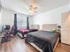 This is a bedroom with two beds, ceiling fan and computer desk at 3403 Greenwich Village Blvd # 104, Orlando, FL 32835
