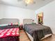 Bedroom with two beds, ceiling fan and open closet at 3403 Greenwich Village Blvd # 104, Orlando, FL 32835