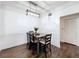 Cozy dining area features modern lighting, dark wood floors, and neutral walls perfect for entertaining at 3403 Greenwich Village Blvd # 104, Orlando, FL 32835