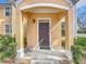Inviting front entrance featuring a stylish door with decorative accents, enhanced by an attractive entryway at 3403 Greenwich Village Blvd # 104, Orlando, FL 32835