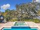Poolside hot tub offers a relaxing and luxurious experience with views of the lake at 3403 Greenwich Village Blvd # 104, Orlando, FL 32835
