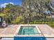 Poolside hot tub offers a relaxing and luxurious experience with views of the lake at 3403 Greenwich Village Blvd # 104, Orlando, FL 32835