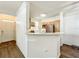 Bright kitchen with wood cabinetry, breakfast bar, and stainless steel refrigerator, creating an inviting space at 3403 Greenwich Village Blvd # 104, Orlando, FL 32835