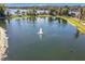Scenic lake view with fountain and park at 3403 Greenwich Village Blvd # 104, Orlando, FL 32835