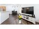 Stylish living area open to the dining space and a large TV, perfect for entertaining at 3403 Greenwich Village Blvd # 104, Orlando, FL 32835