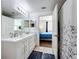 Bright bathroom with dual sinks, white cabinets, and access to the main bedroom, blending comfort and style at 3403 Greenwich Village Blvd # 104, Orlando, FL 32835