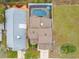 Aerial view of the home displaying the roof, screened pool, and the landscaping at 3509 S Saint Lucie Dr, Casselberry, FL 32707