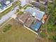 Aerial view of the home displaying the fenced backyard pool and the adjacent homes at 3509 S Saint Lucie Dr, Casselberry, FL 32707