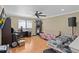 Bonus room including a dart board game, desk, and hardwood flooring at 3509 S Saint Lucie Dr, Casselberry, FL 32707