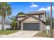 Charming two-story home with a well-manicured lawn and a spacious two-car garage at 3509 S Saint Lucie Dr, Casselberry, FL 32707
