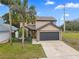 Charming two-story home with a well-manicured lawn and a spacious two-car garage at 3509 S Saint Lucie Dr, Casselberry, FL 32707