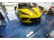 View of the epoxy floor and a bright yellow sports car parked in the garage at 3509 S Saint Lucie Dr, Casselberry, FL 32707