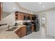 Modern kitchen featuring granite countertops, stainless steel appliances, and ample cabinet space at 3509 S Saint Lucie Dr, Casselberry, FL 32707