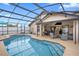 Large in-ground pool with a screened enclosure, ideal for entertaining and enjoying the outdoors at 3509 S Saint Lucie Dr, Casselberry, FL 32707