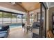 Outdoor screened-in patio area with a BBQ grill and comfortable seating near the pool at 3509 S Saint Lucie Dr, Casselberry, FL 32707