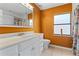 Bathroom with modern vanity and large window at 35624 Cypress Ct, Leesburg, FL 34788