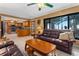Inviting living room with tile floors, comfortable seating, and seamless access to the kitchen and outdoor spaces at 35624 Cypress Ct, Leesburg, FL 34788