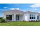 The backyard shows a well-maintained lawn at 4192 Barbuda Ln, Kissimmee, FL 34758