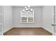 Bright dining room with tile floors and a chandelier at 4192 Barbuda Ln, Kissimmee, FL 34758