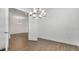 Open dining room with modern chandelier lighting at 4192 Barbuda Ln, Kissimmee, FL 34758