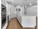 Bright, open kitchen features white cabinets, stainless appliances, and large center island at 4192 Barbuda Ln, Kissimmee, FL 34758