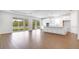 Open floorplan with a kitchen featuring white cabinets and a stainless steel microwave at 4192 Barbuda Ln, Kissimmee, FL 34758
