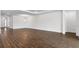 Spacious living room with wood-look tile flooring and ample natural light at 4192 Barbuda Ln, Kissimmee, FL 34758