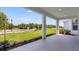 Covered back porch with nice views overlooking the manicured backyard at 4198 Barbuda Ln, Kissimmee, FL 34758