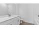 Clean bathroom with white cabinets, countertop, and tile at 4198 Barbuda Ln, Kissimmee, FL 34758