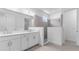 Spacious bathroom with dual sinks, modern finishes, and separate shower at 4198 Barbuda Ln, Kissimmee, FL 34758