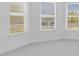 Carpeted bedroom with bright natural light from three windows at 4198 Barbuda Ln, Kissimmee, FL 34758