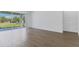 Open living room featuring sliding glass doors, recessed lighting, and contemporary flooring for an airy and inviting space at 4198 Barbuda Ln, Kissimmee, FL 34758