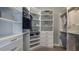 Organized walk-in closet featuring custom shelving, drawers, and ample hanging space for clothing and accessories at 4198 Barbuda Ln, Kissimmee, FL 34758