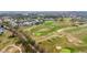 Aerial view showcases the expansive golf course community with meandering paths and lush green fairways at 438 Belfry Dr, Davenport, FL 33897