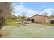 The spacious backyard features a basketball court and pool, perfect for outdoor activities and entertaining at 453 Weathersfield Ave, Altamonte Springs, FL 32714