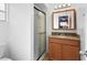 Bathroom featuring a glass shower, granite countertop vanity, and neutral decor at 453 Weathersfield Ave, Altamonte Springs, FL 32714