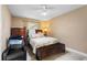 Comfortable bedroom with neutral walls, tiled floors, a ceiling fan, and plenty of natural light at 453 Weathersfield Ave, Altamonte Springs, FL 32714