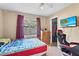 Bedroom featuring tiled floor, ceiling fan, closet, large window, and desk at 453 Weathersfield Ave, Altamonte Springs, FL 32714