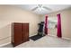 Bedroom featuring tiled floor, treadmill, ceiling fan, and plenty of natural light at 453 Weathersfield Ave, Altamonte Springs, FL 32714