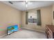 Bedroom featuring tiled floors and a large window, offering bright, natural light at 453 Weathersfield Ave, Altamonte Springs, FL 32714