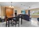 Dining area adjacent to the living room, featuring a dark wood dining set at 453 Weathersfield Ave, Altamonte Springs, FL 32714